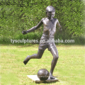 China factory supplied life size bronze young boy playing football models sculpture for garden decoration